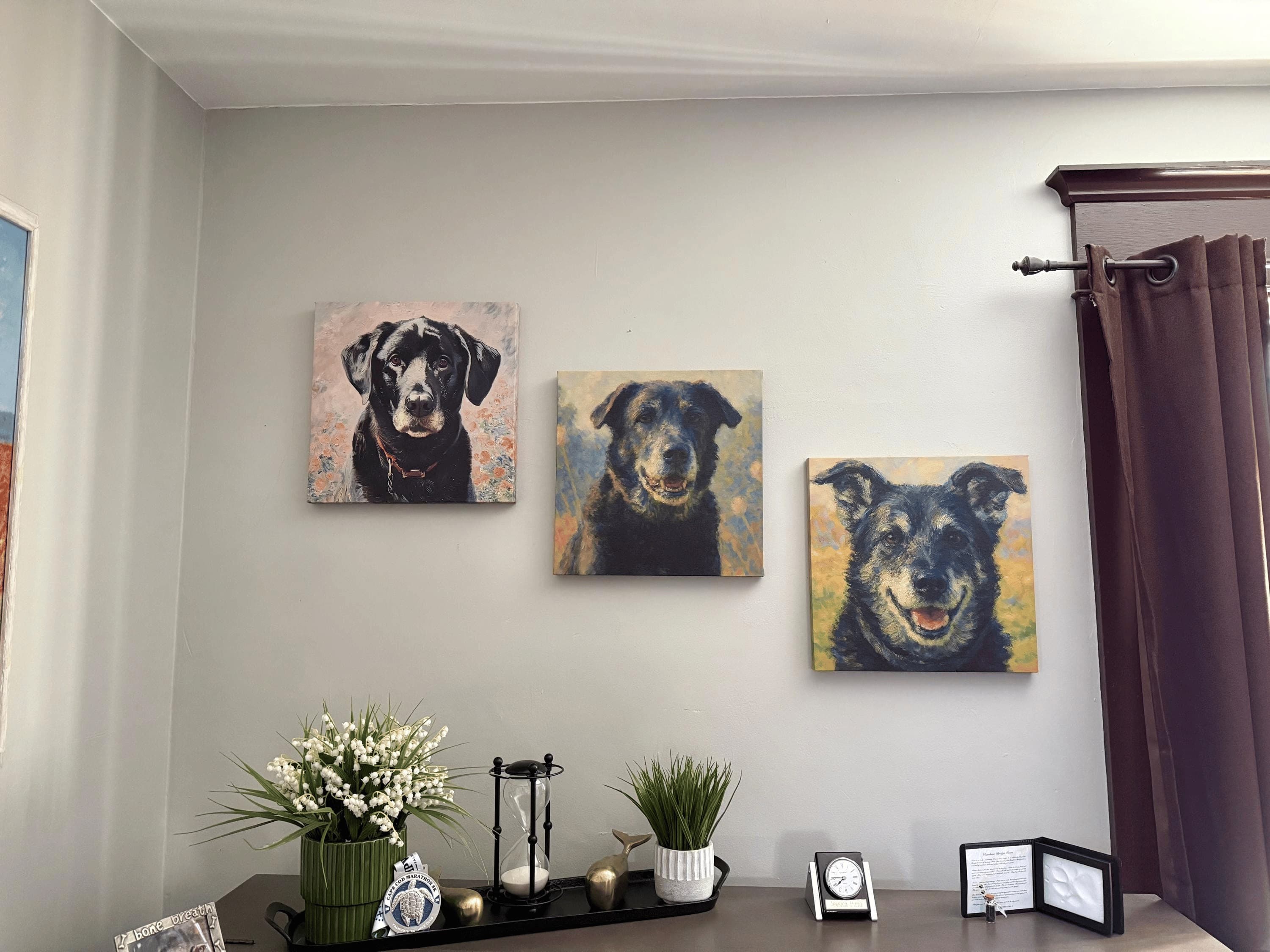 Three custom pet portraits displayed on Jessica's wall